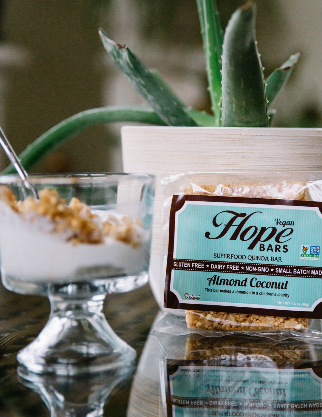 Almond coconut Hope Bar next to bowl of yogurt